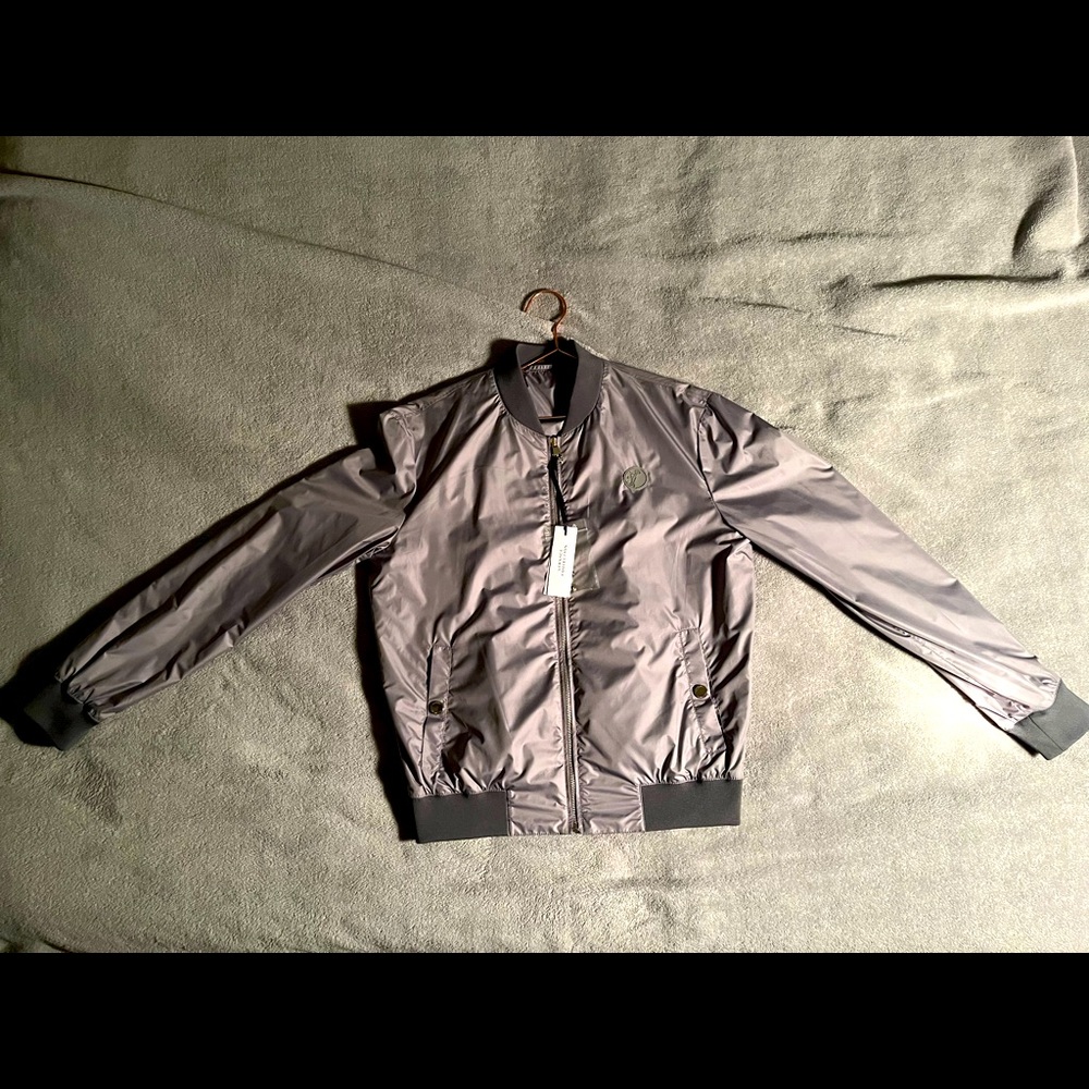 Versace windbreaker Jacket. Has Medusa emblem on zipper/front of jacket.